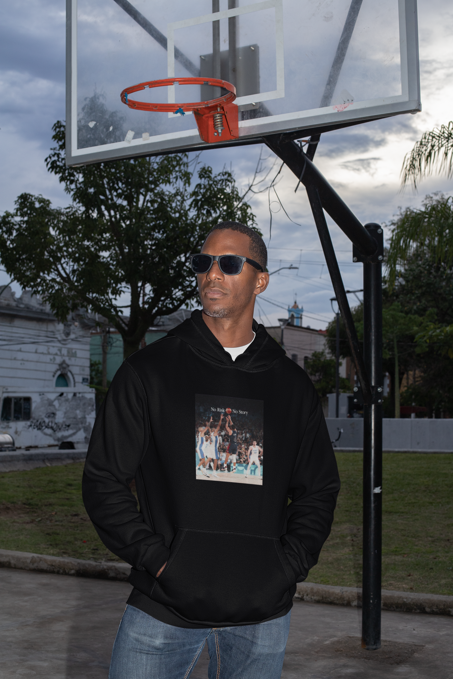 mockup-of-a-fashionable-man-wearing-a-pullover-hoodie-at-a-basketball-court-30460.png